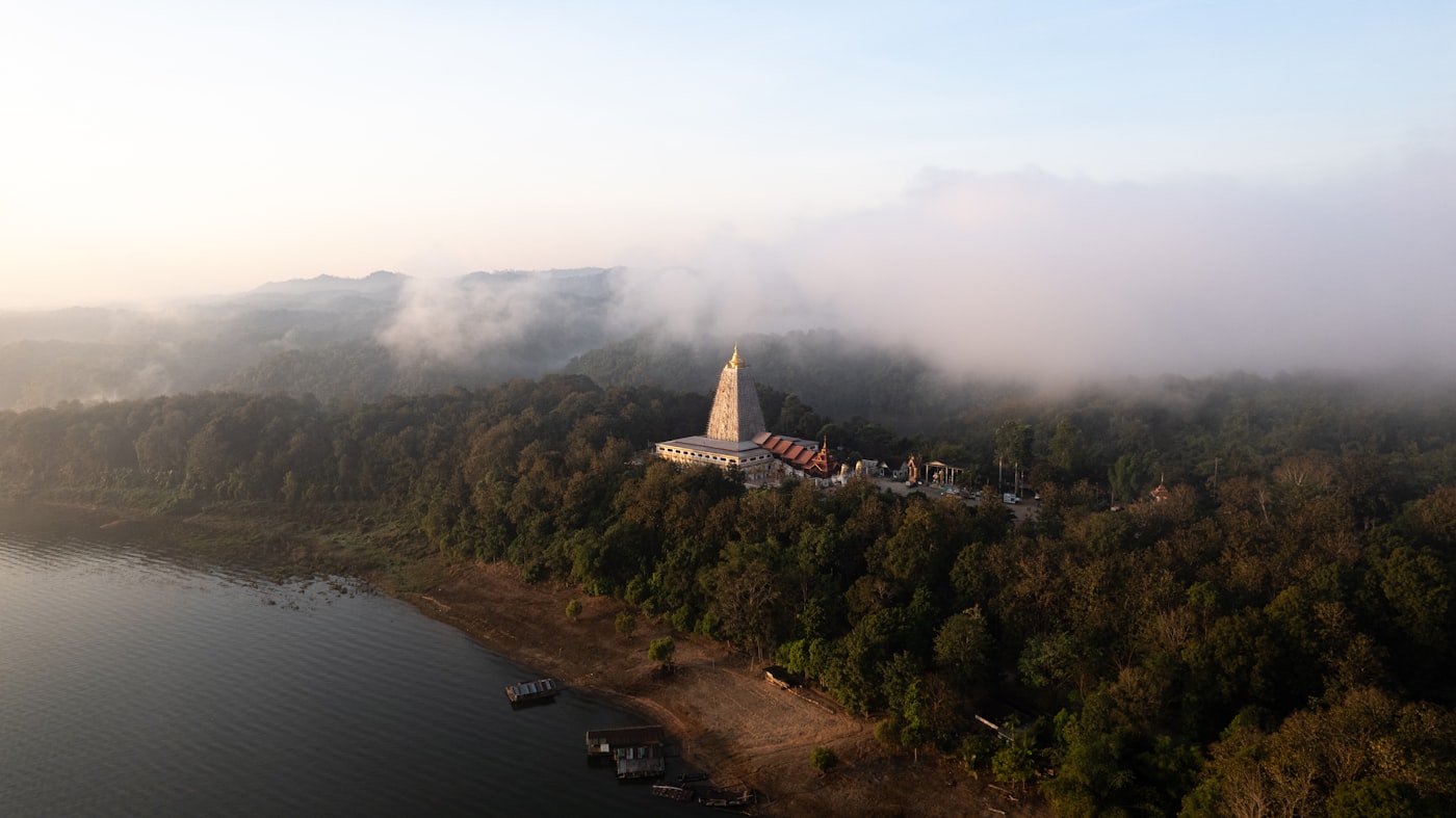 Misty Khao Yai highland forest at dawn — the natural foundation of the center